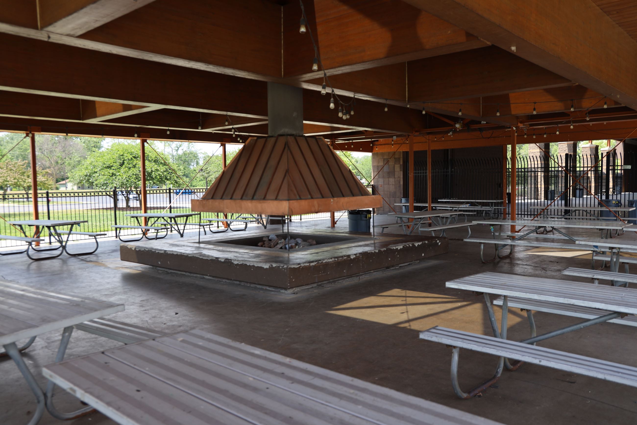 Pavilion area with picnic tables at the Lamarand Splash pad. 