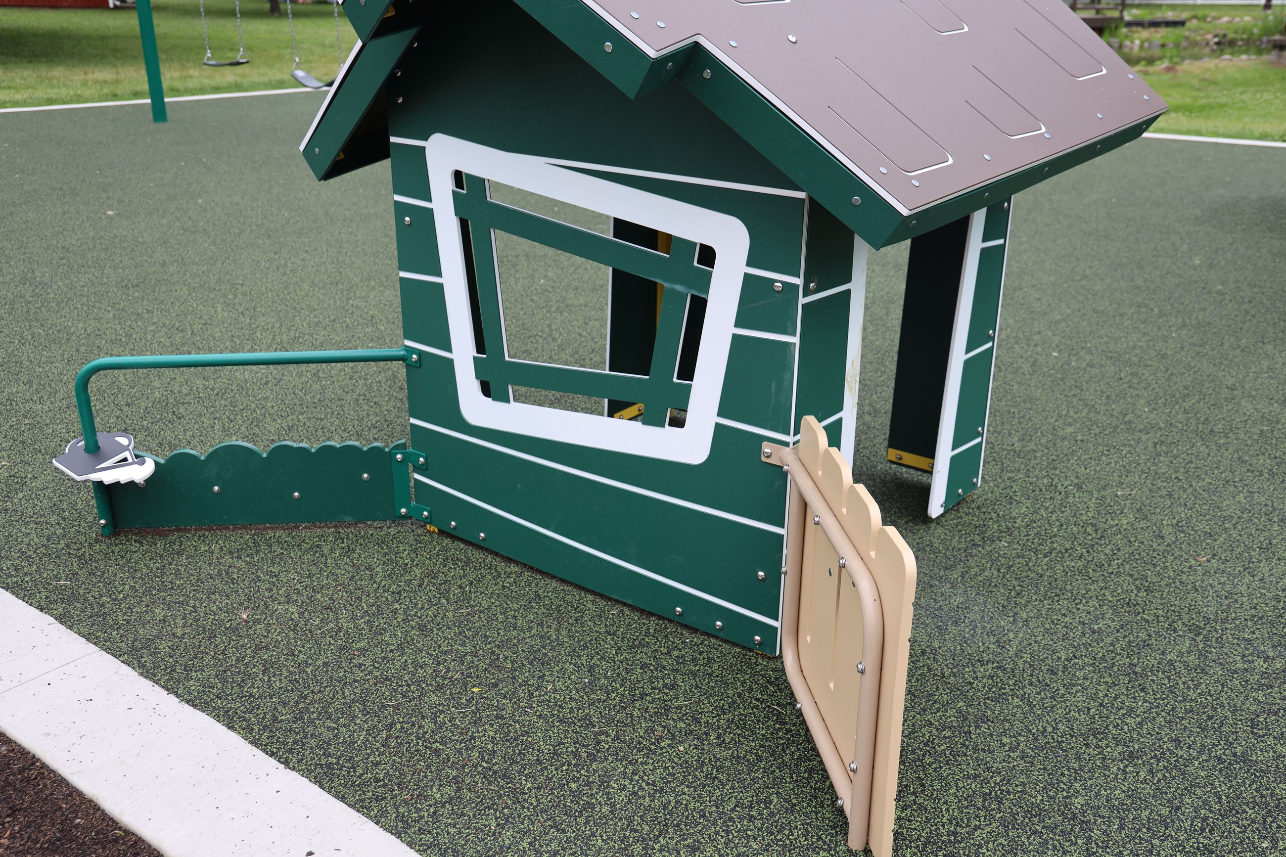Toddlers playhouse on the petting farm's playscape. 