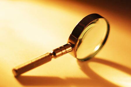 Stock image of a Magnifying Glass stood on its side. 